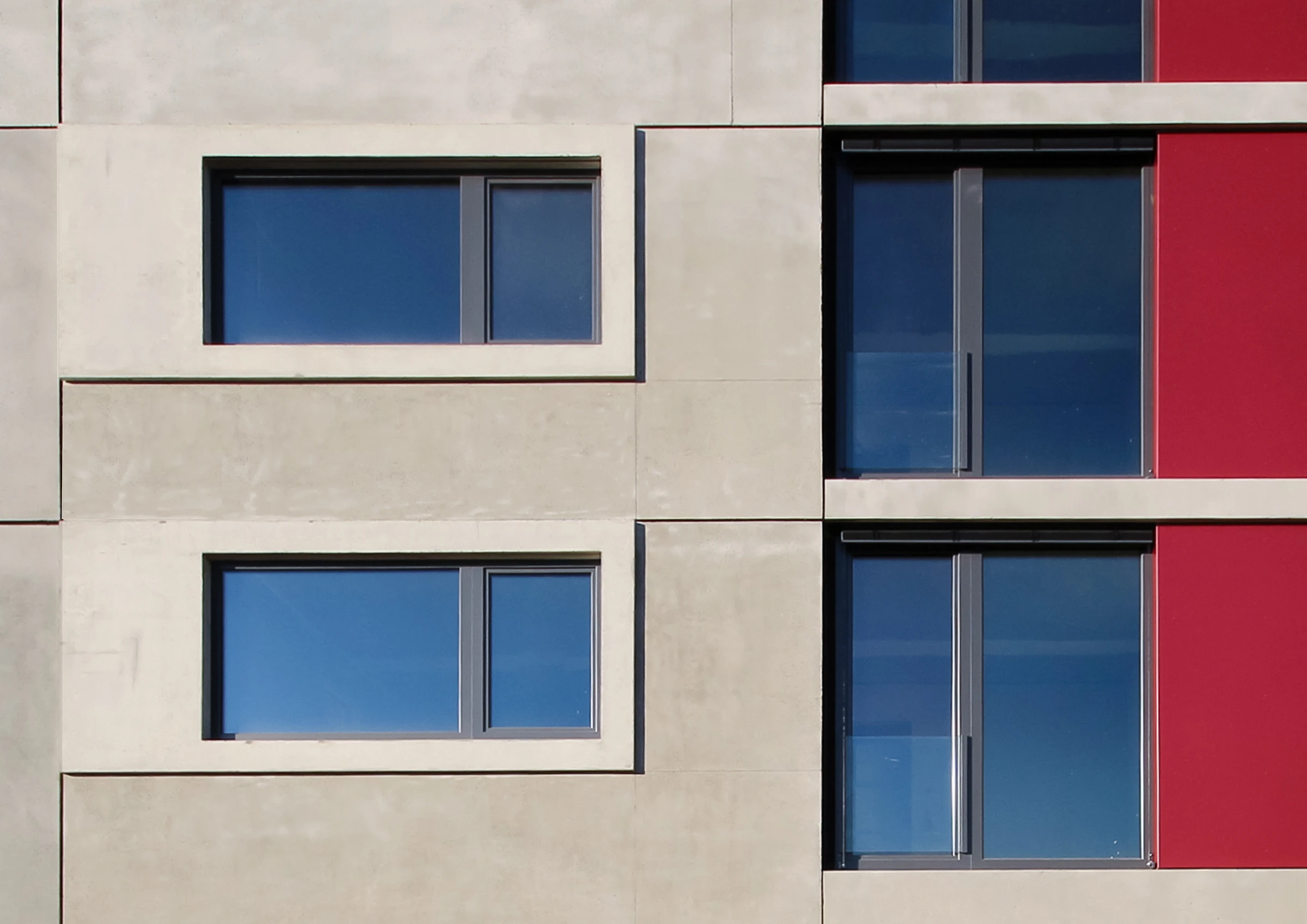 Sichtbetonfassade mti Faserzementplatten an einem Studentenwohnheim